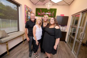 members posing in their suite.