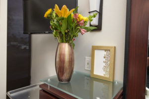 gold vase with flowers