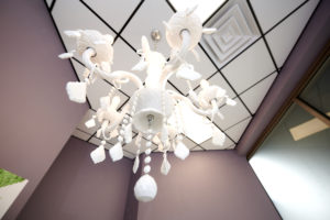 white chandelier in suite