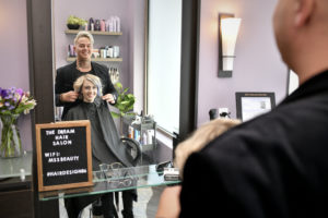 MY SALON Suite Member Josh Trotter and his client looking in the mirror