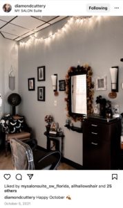 picture of a suite with lights hanging on the ceiling and halloween decor on the walls