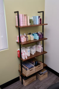 More shelving displaying hair products.