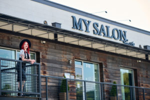 Karinna standing outside in from of MY SALON Suite