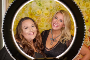 the two members smiling in their suite