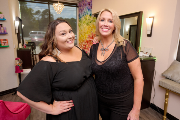 tanya and katlyn smiling in their suite