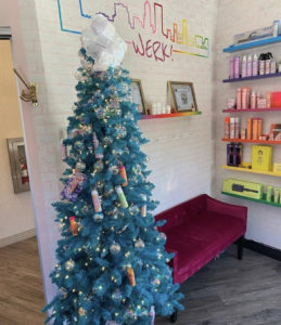 Picture of a blue Christmas Tree in a suite.