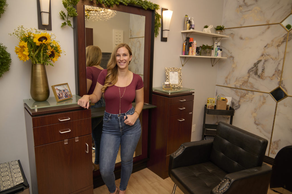 Dakota standing in her suite.