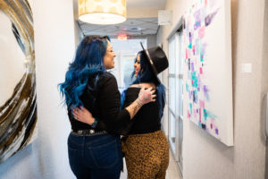 MY SALON Suite Member Nicole in the hallway with her client