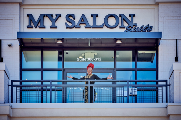 woman posing outside of my salon suite