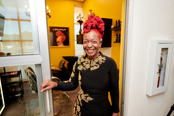 MY SALON Suite Member standing in her suite door