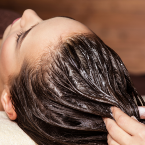 picture of wet hair being combed through.