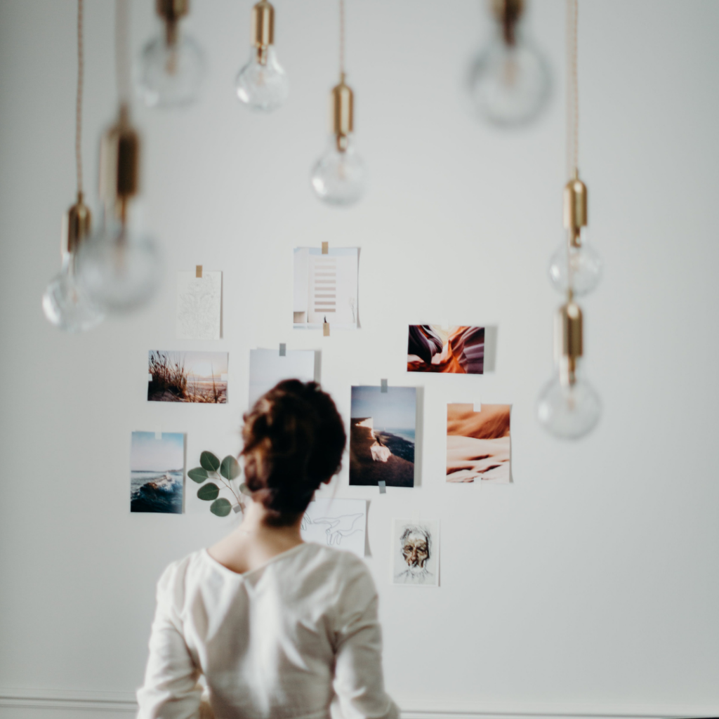 woman putting ideas and goals on wall