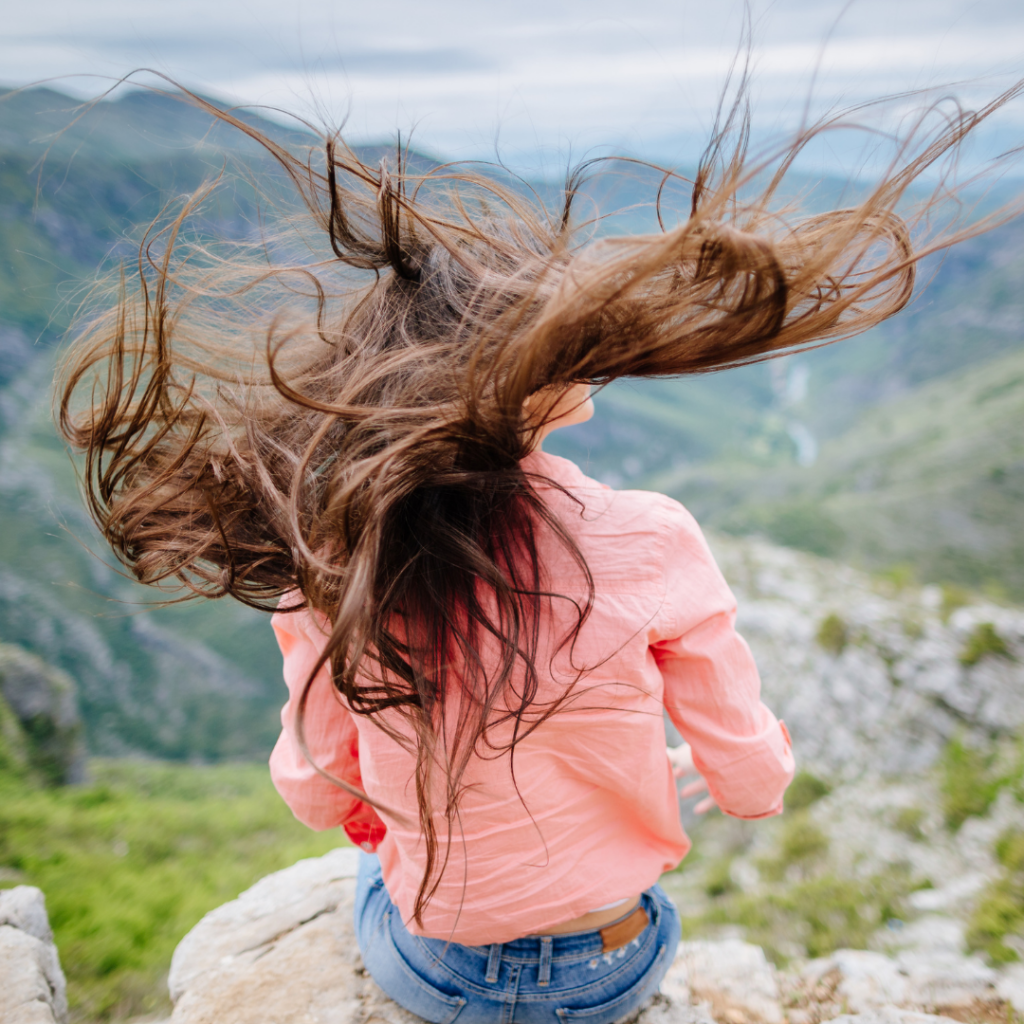 woman with hair blowing in wind