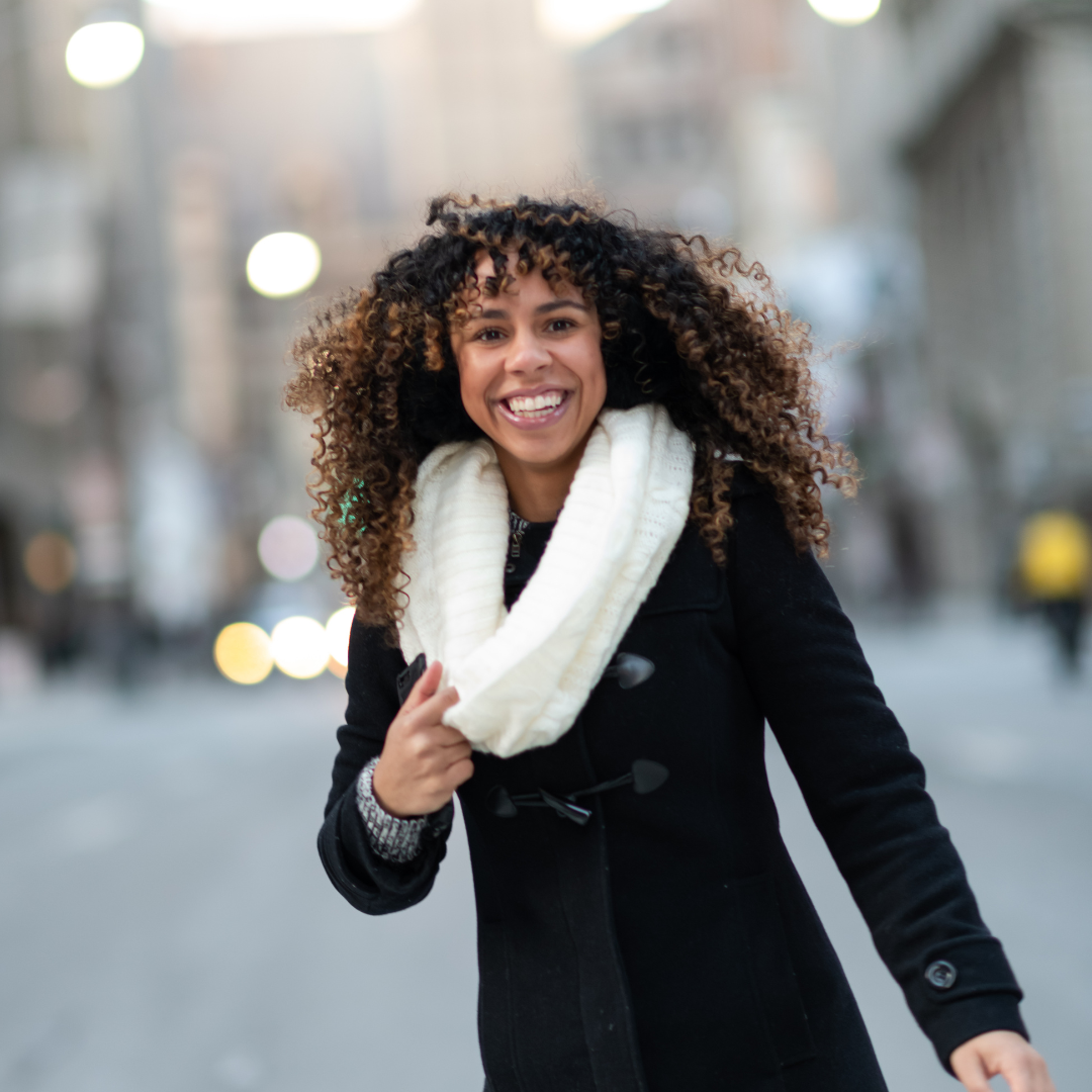 woman smiling in street
