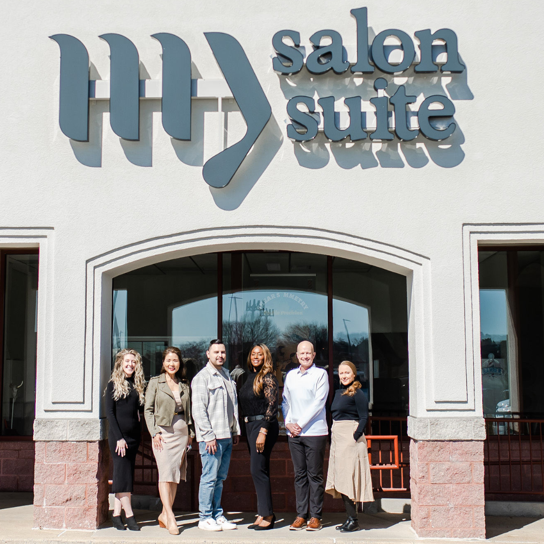 members standing in front of a My Salon Suite location