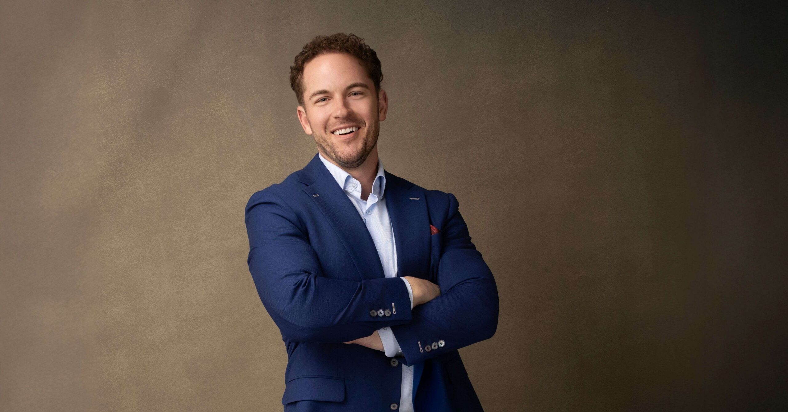 A smiling former teacher turned My Salon Suite franchise owner